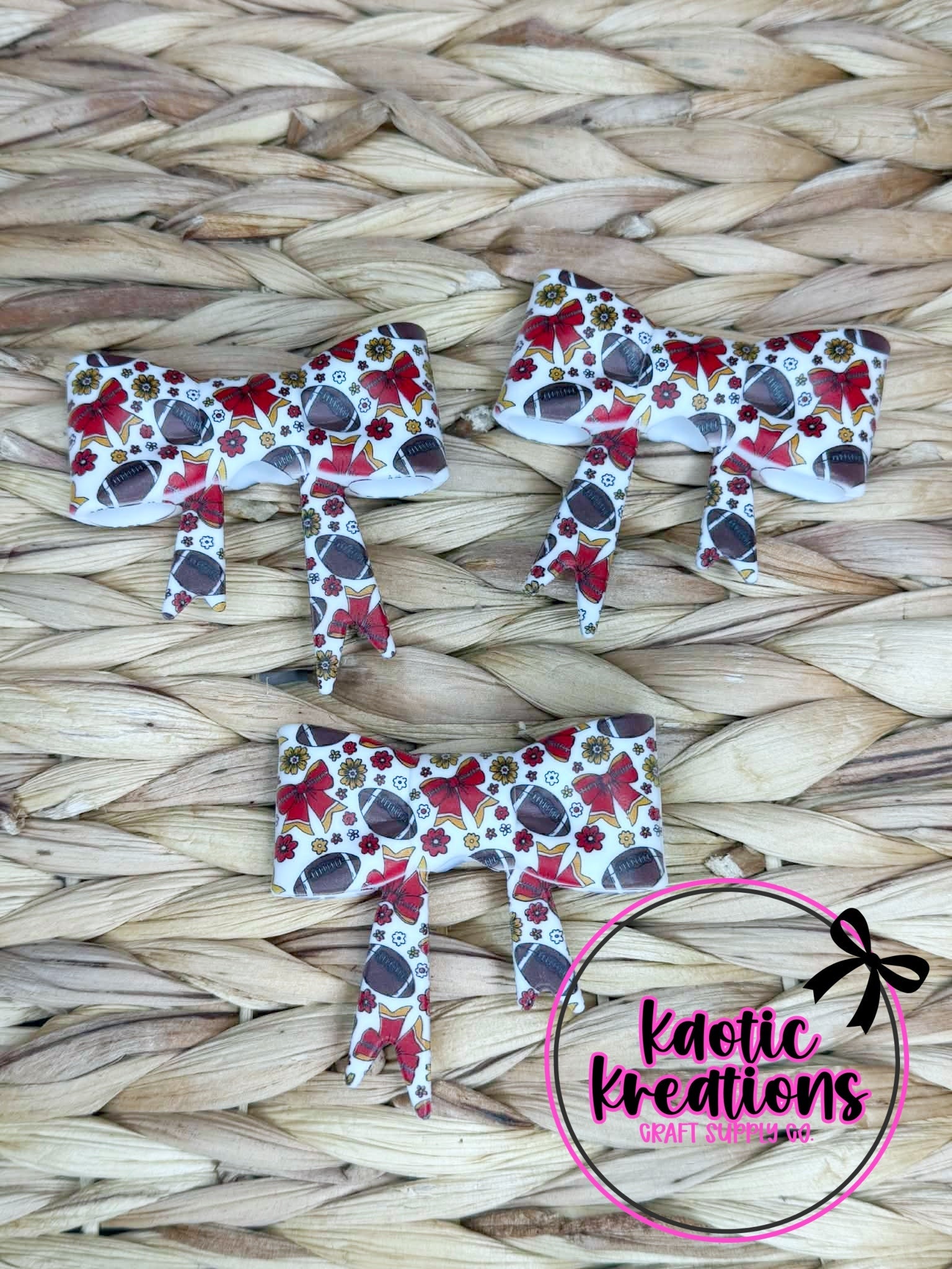 (DISCONTINUED) BEADABLE JUMBO SILICONE BOW RED BOWS AND FOOTBALLS (1ct)